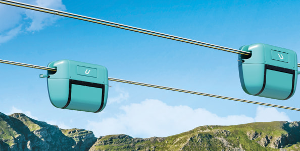 Use of string transport to traverse mountainous obstacles Use of string transport to traverse mountainous obstacles