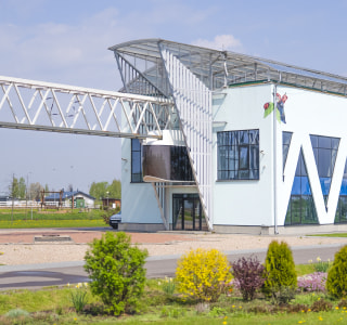48-seat quad-rail uBus leaves the passenger station. EcoTechnoPark, Maryina Gorka, 2022 48-seat quad-rail uBus leaves the passenger station. EcoTechnoPark, Maryina Gorka, 2022