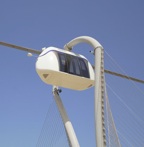 uSky Test & Certification Center, Sharjah (UAE), 2020. uCont (right) and uCar in tropical version (left) on the flexible string rail overpass uSky Test & Certification Center, Sharjah (UAE), 2020. uCont (right) and uCar in tropical version (left) on the flexible string rail overpass