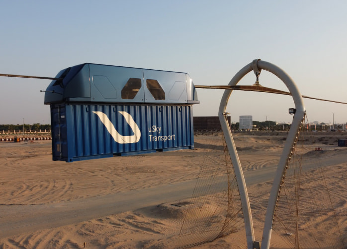 uSky Test & Certification Center, Sharjah (UAE), 2020. uCont (right) and uCar in tropical version (left) on the flexible string rail overpass uSky Test & Certification Center, Sharjah (UAE), 2020. uCont (right) and uCar in tropical version (left) on the flexible string rail overpass